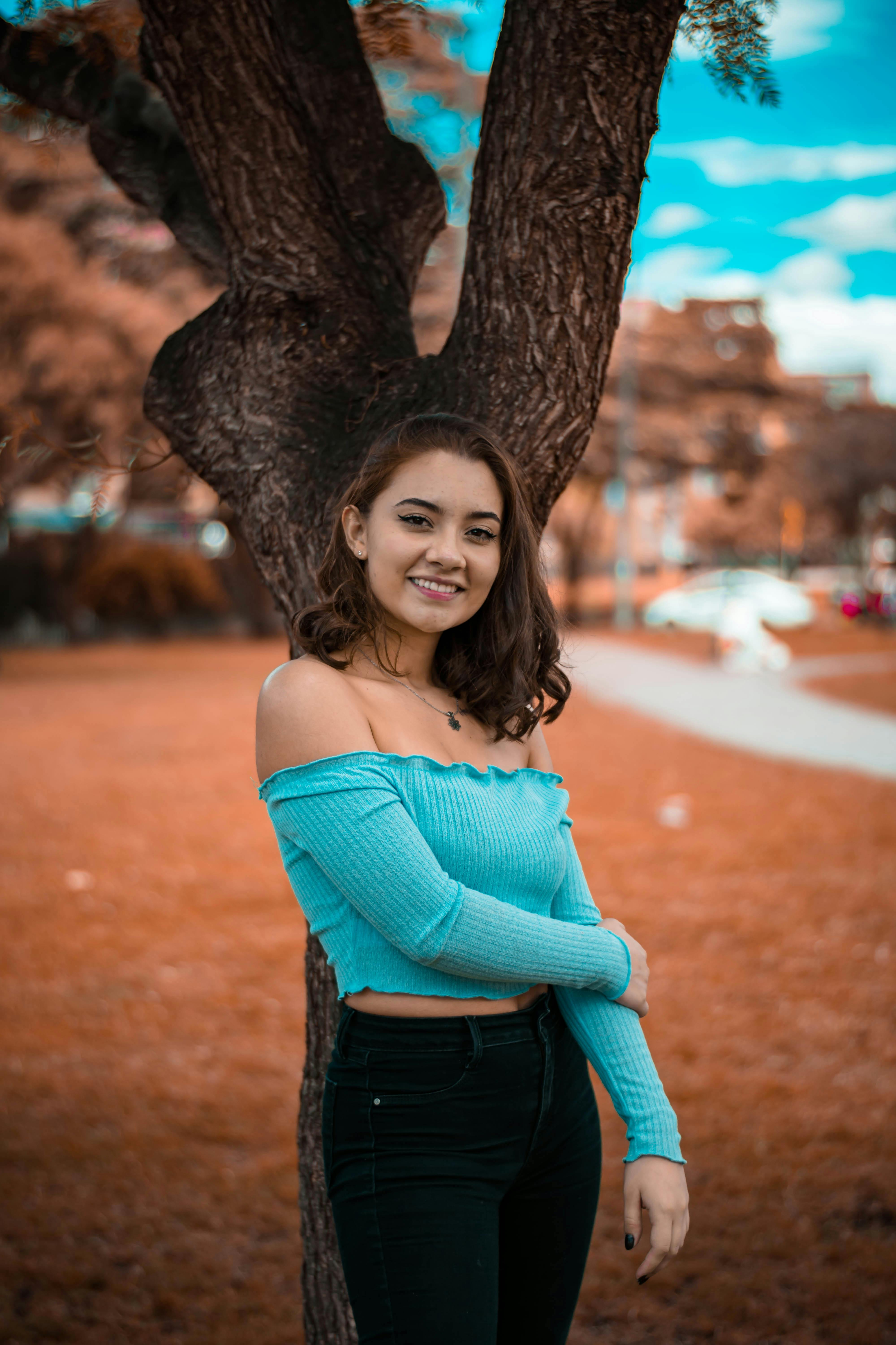 Woman in green off-shoulder top holding her hair pose photo – Free  Production Image on Unsplash